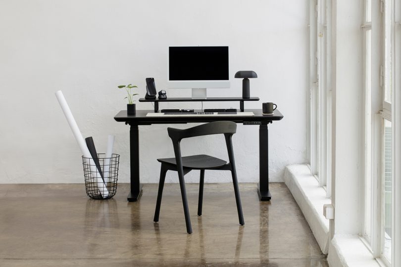 styled dark wood and black office desk and chair