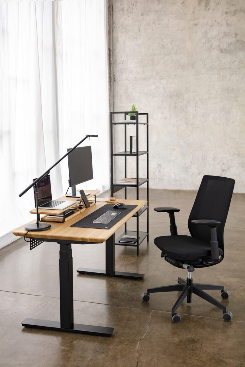 styled light wood and black office desk with office chair