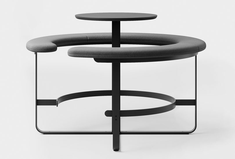 black circular table surrounded by an attached circular bench
