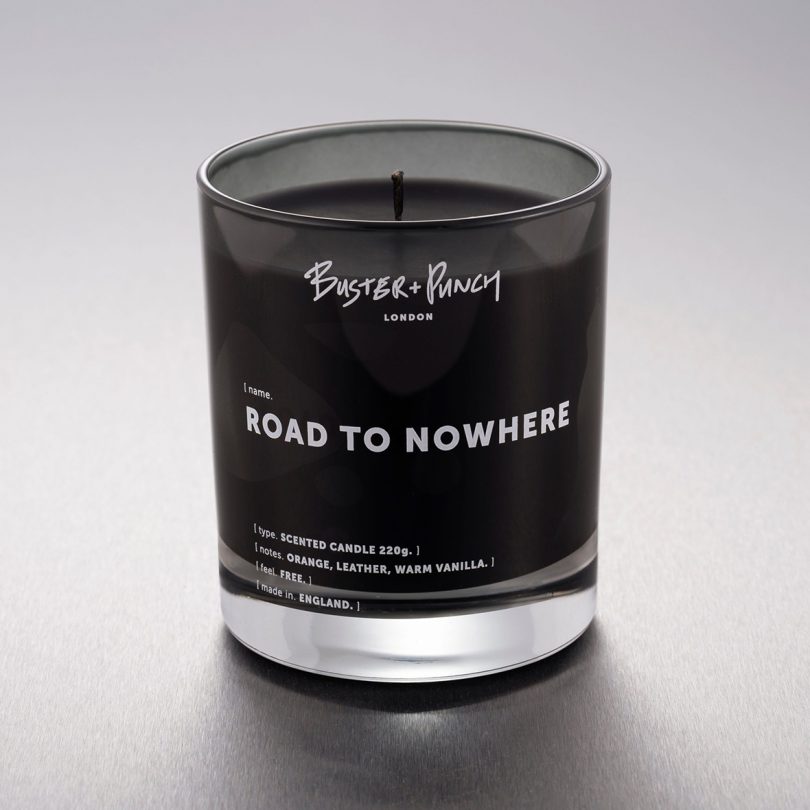 black glass jar candle that reads ROAD TO NOWHERE