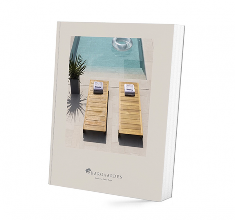 book cover with a photo of two wooden outdoor day loungers by a pool on a white background