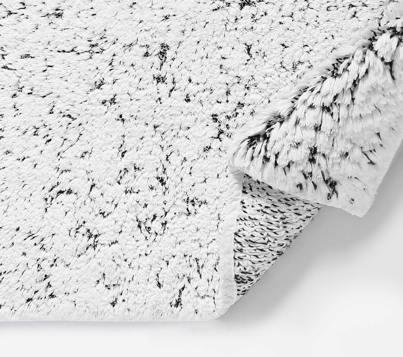 detail of white and black marbled bath rug