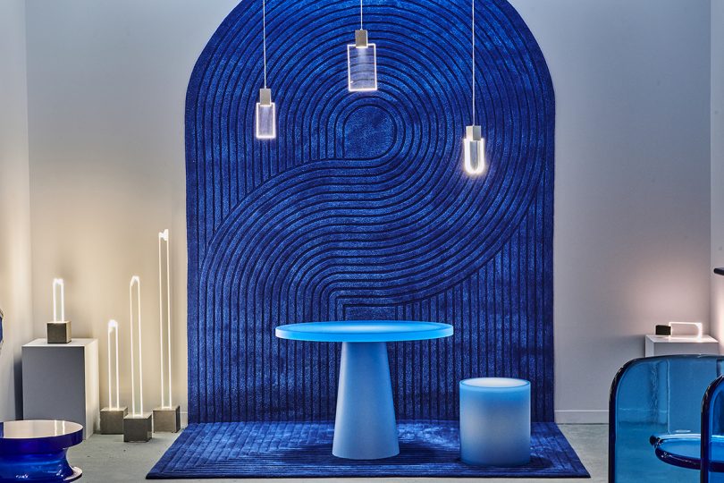 blue dining table and wall at a blue-themed exhibition
