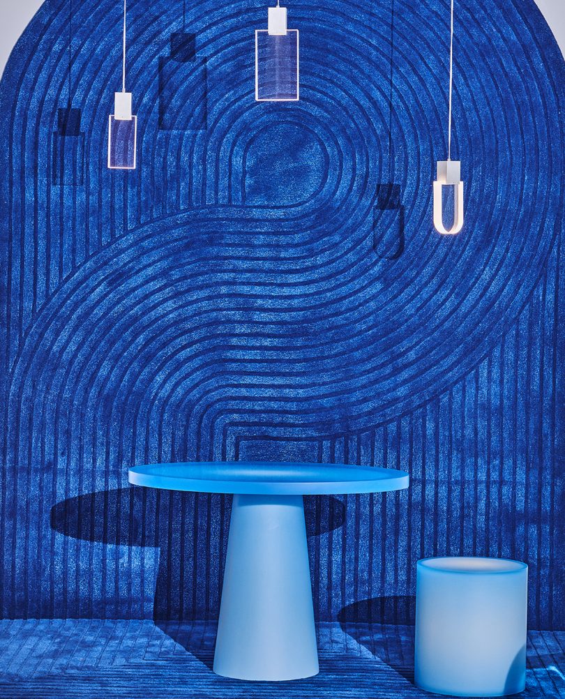 blue dining table and wall at a blue-themed exhibition