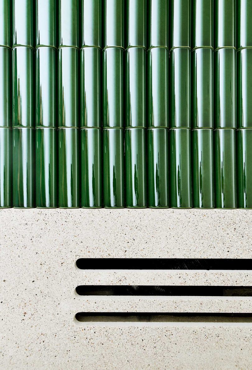 closeup of kelly green rounded rectangular tiles on fireplace