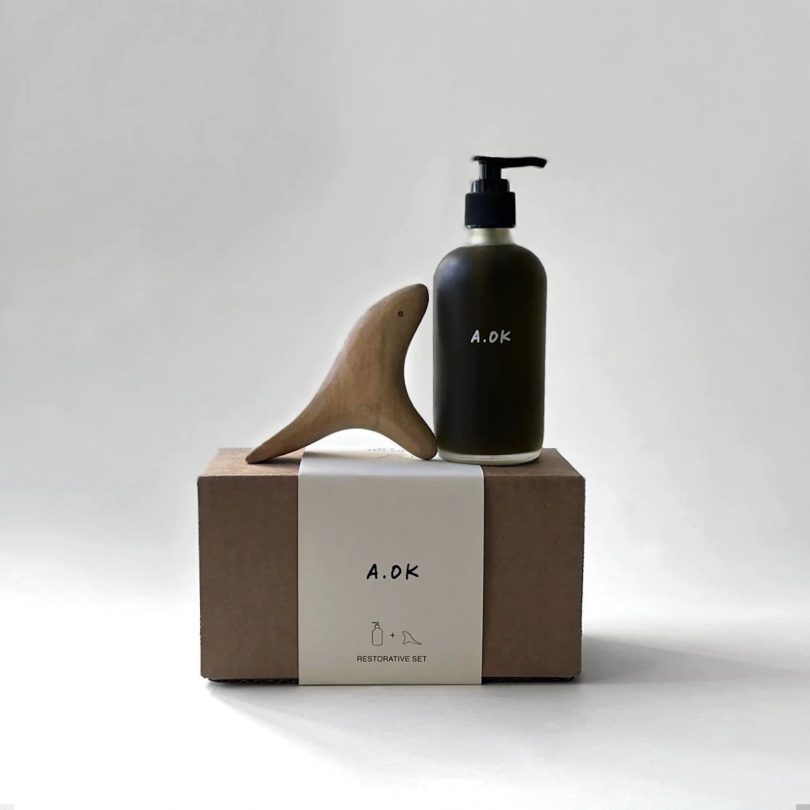 body oil and bird-shaped massager on box