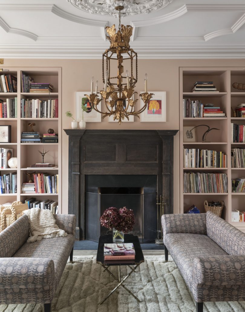 living room with two bookshelves and two sofas
