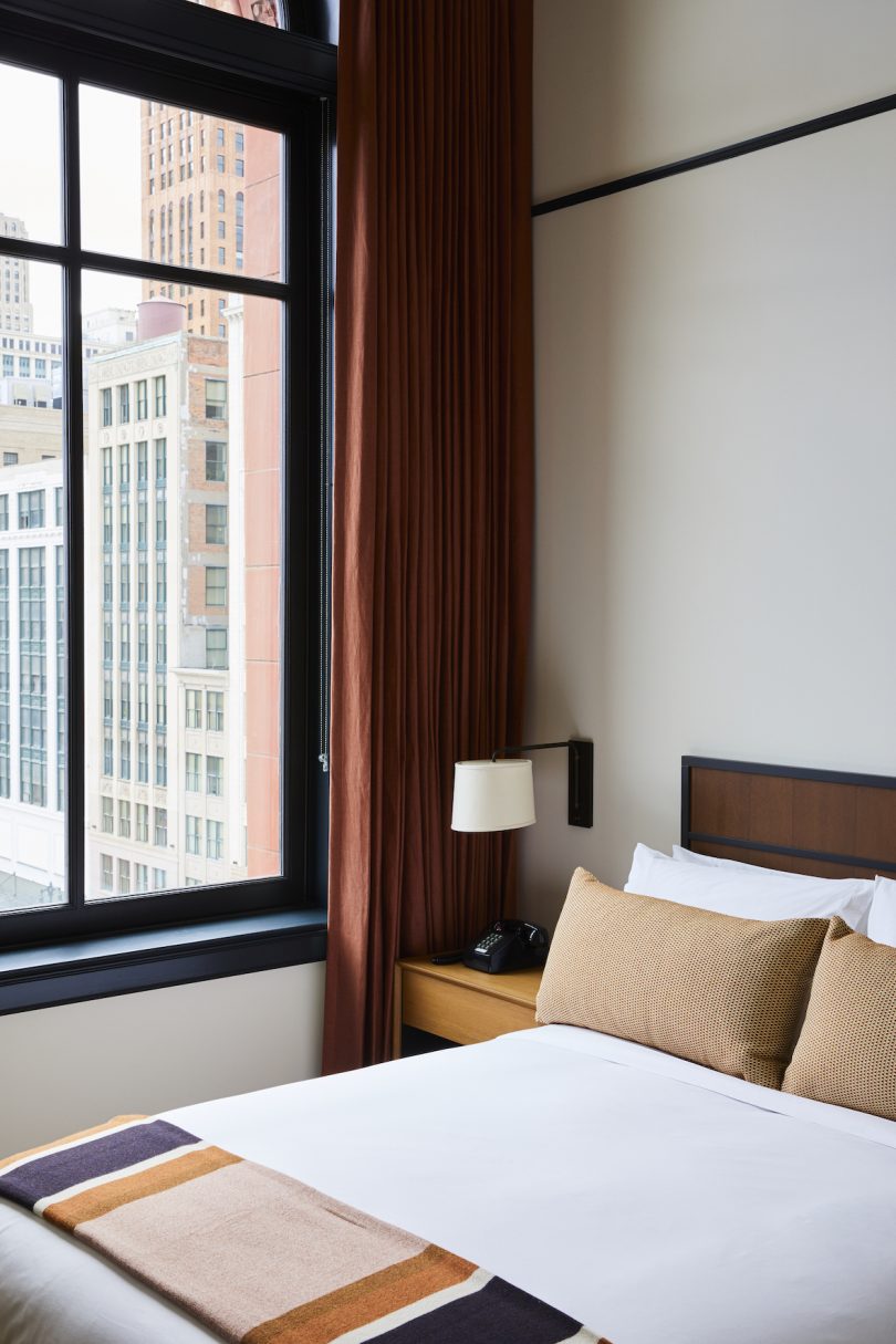 Guest rooms and suites feature a residential-style design with hardwood flooring, and cozy mid- century modern furniture