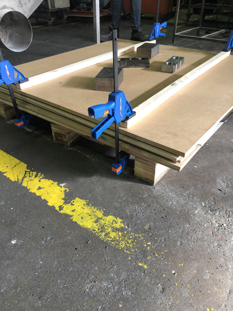 plywood sheets clamped together