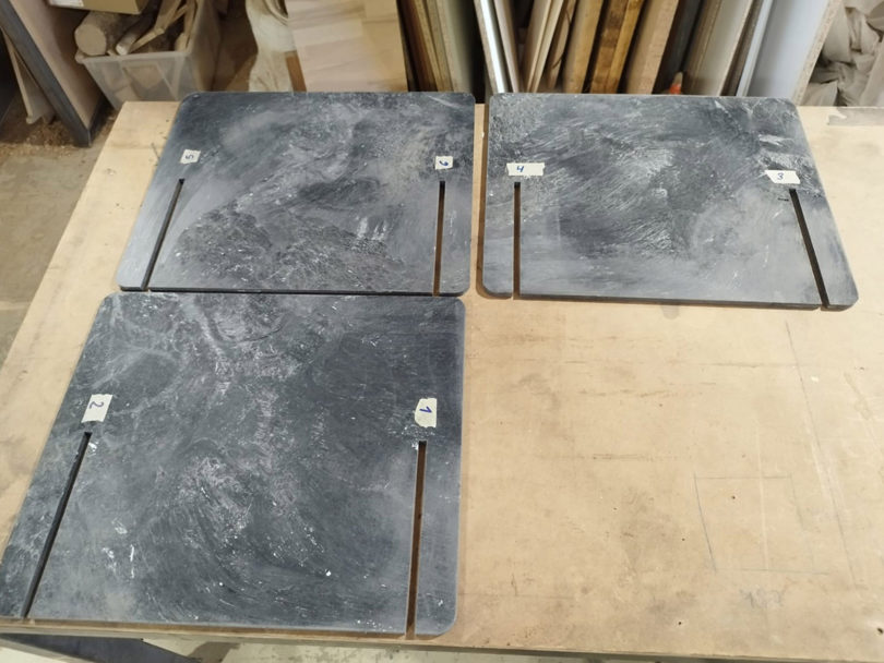 finished pieces of marble-like material ready to be assembled