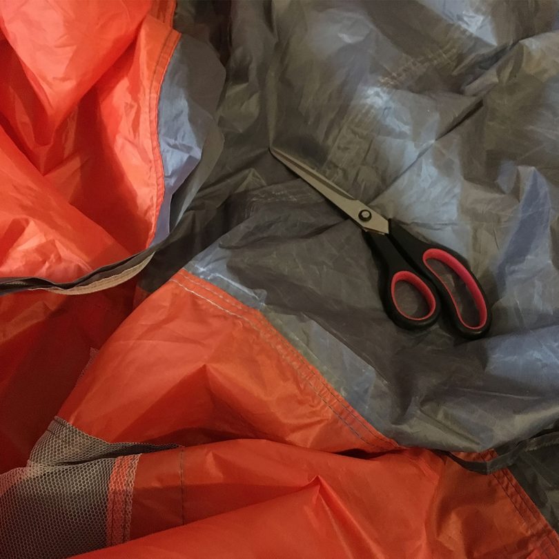 scissors laid on a tent