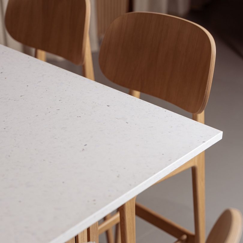 angled down view of white terrazzo like table surface