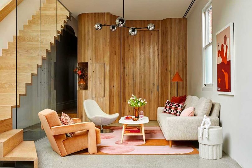 interior shot o modern living room in cool peach shades and wood details