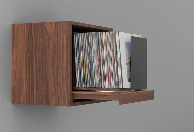 wall-mounted wooden box that holds vinyl
