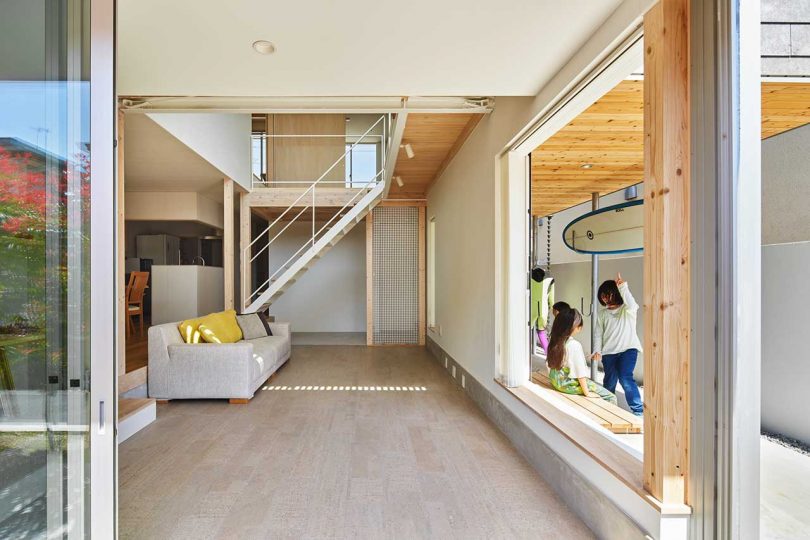 interior of modern Japanese home with double height living room with staircase