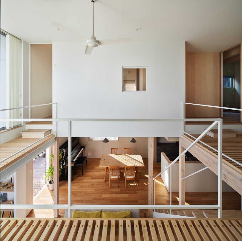 interior of modern Japanese home with double height living room with staircase