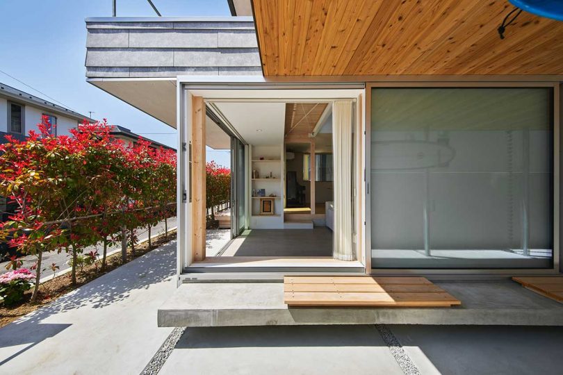 exterior corner of modern Japanese house with square opening to interior