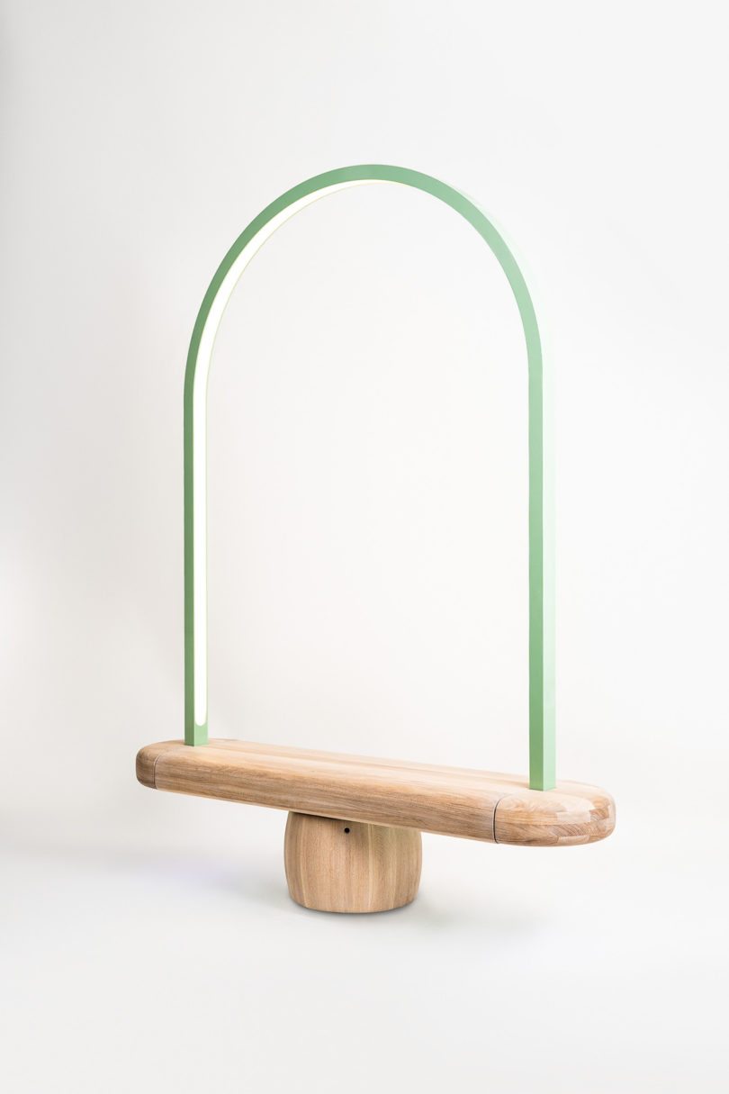 wooden bench with an overarching metal tube