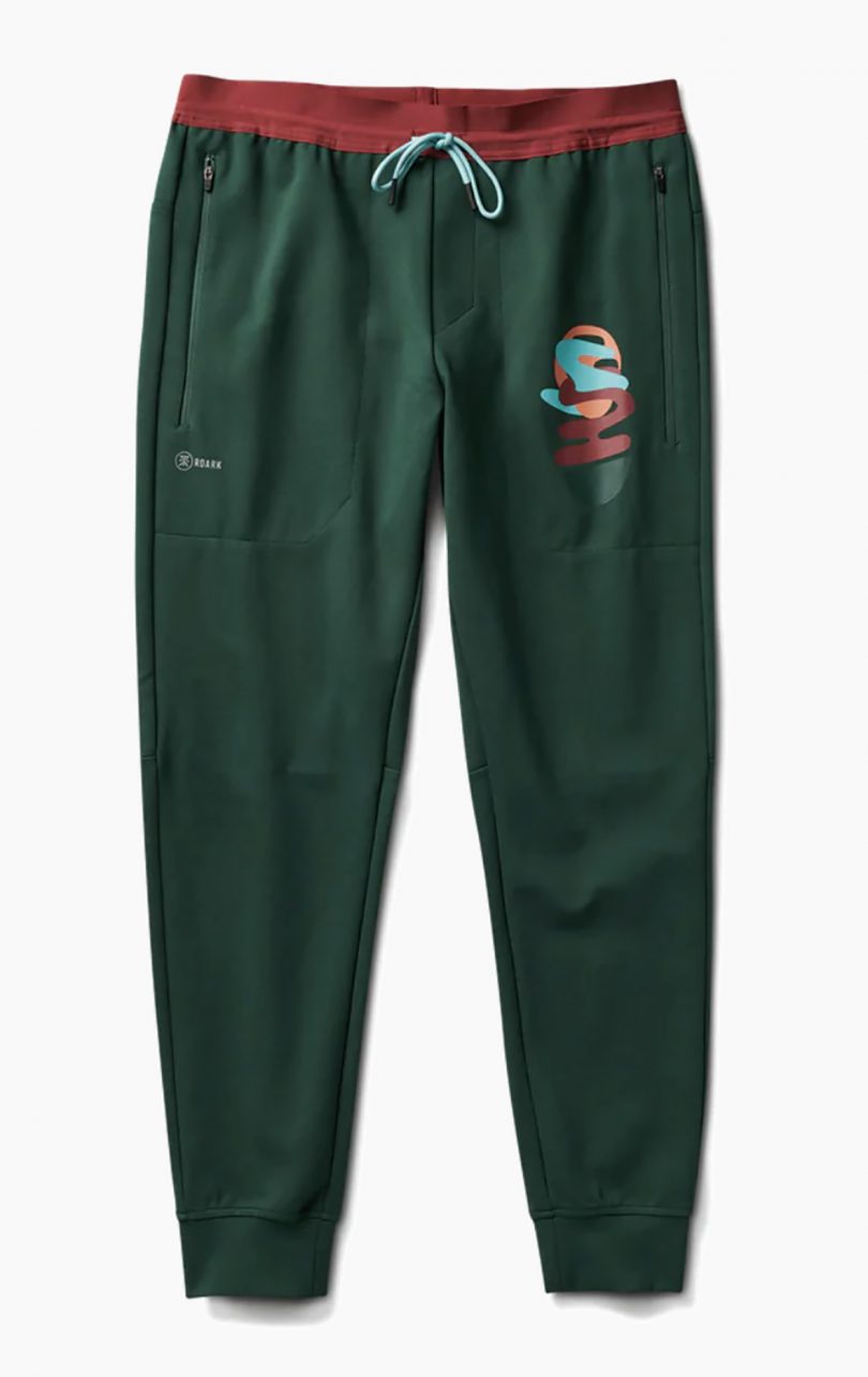 Fleece pants in green against white background.