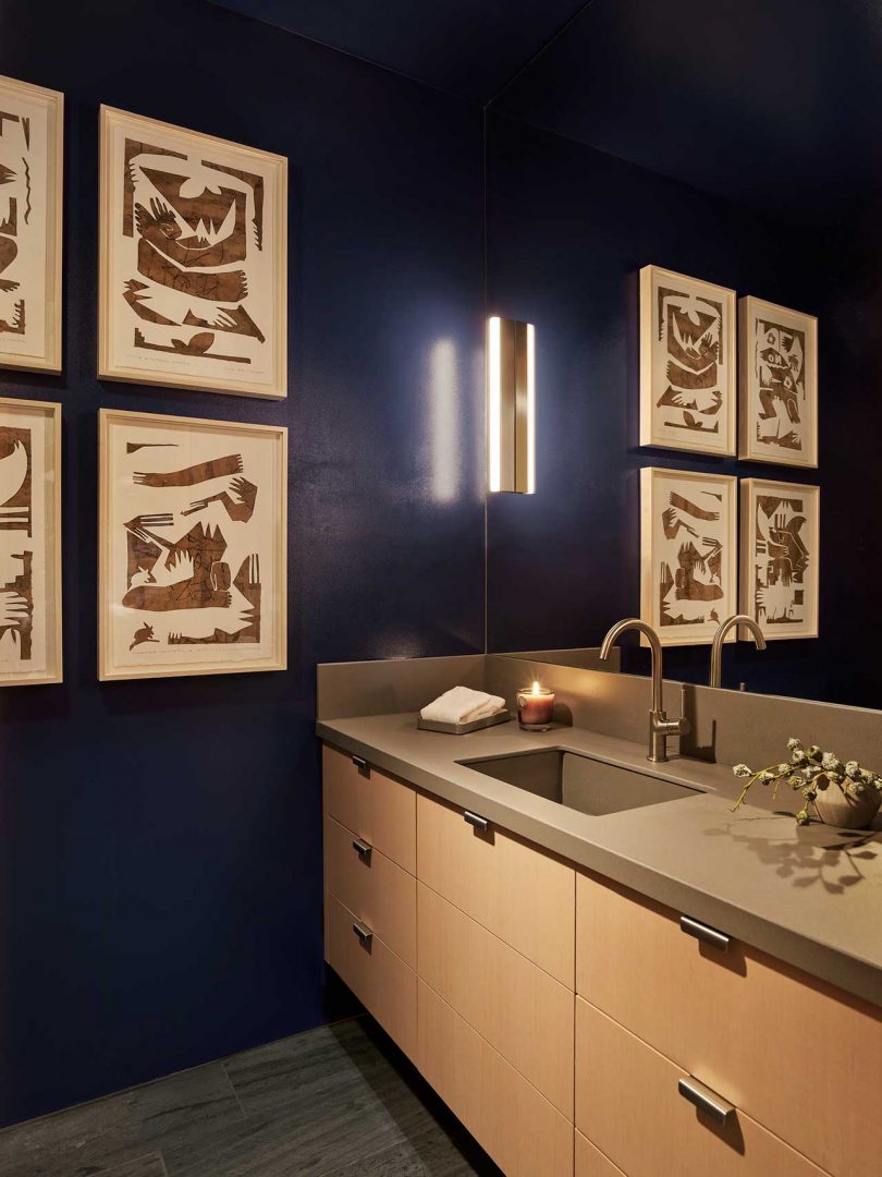 angle view of modern bathroom with deep blue walls