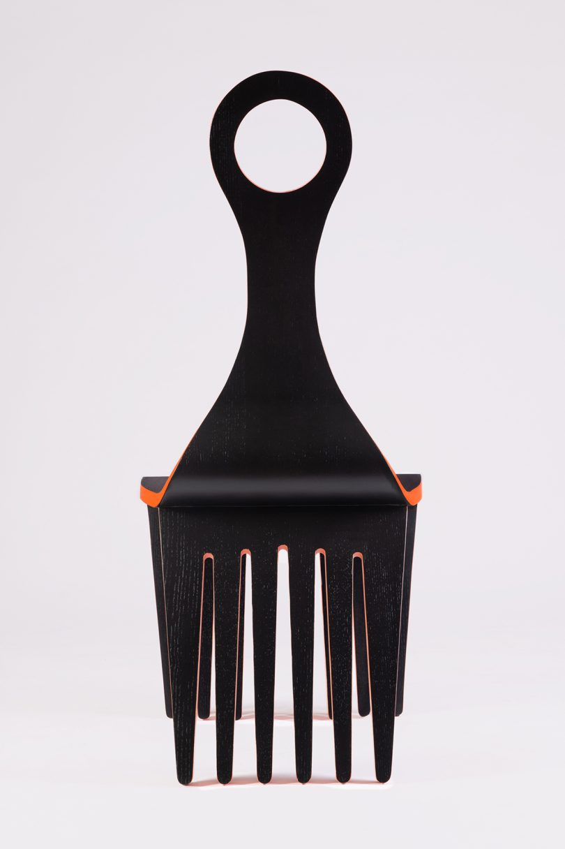 black and orange chair that resembles and Afro Comb