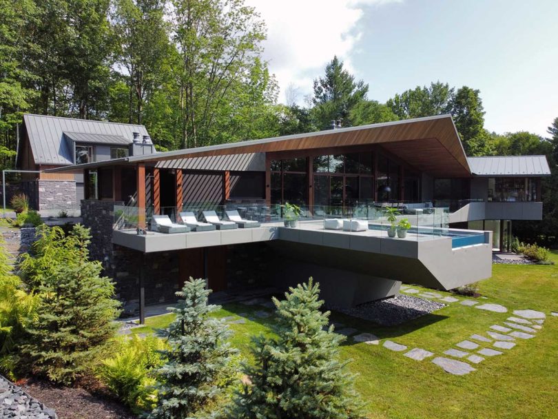 An Angular Lake House in Canada With a Cantilevered Pool