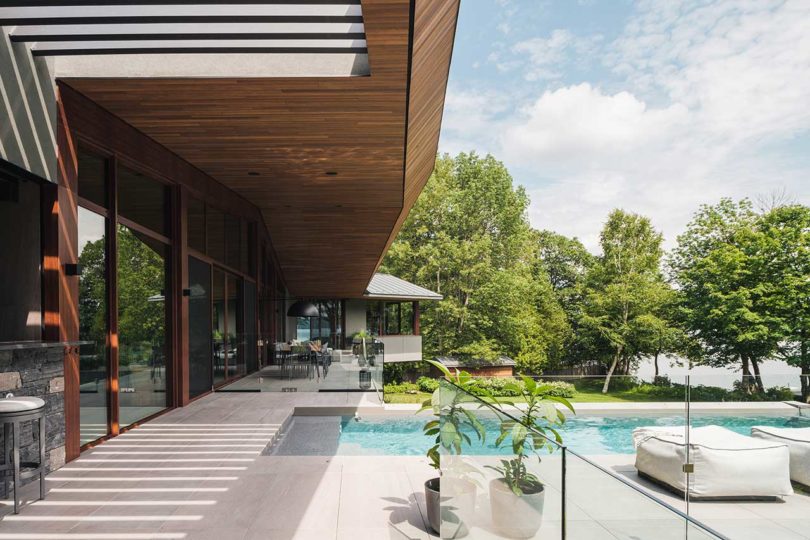 exterior shot of modern angular house with cantilevered pool