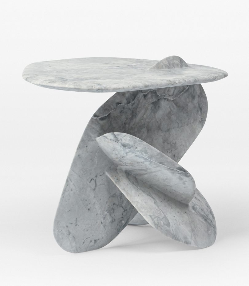 grey stone side table made of intersecting discs