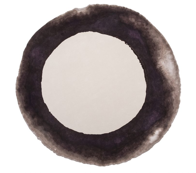 round black and cream rug