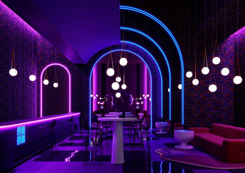 darkened space with orb-shaped pendent lights and blue and pink neon detailing