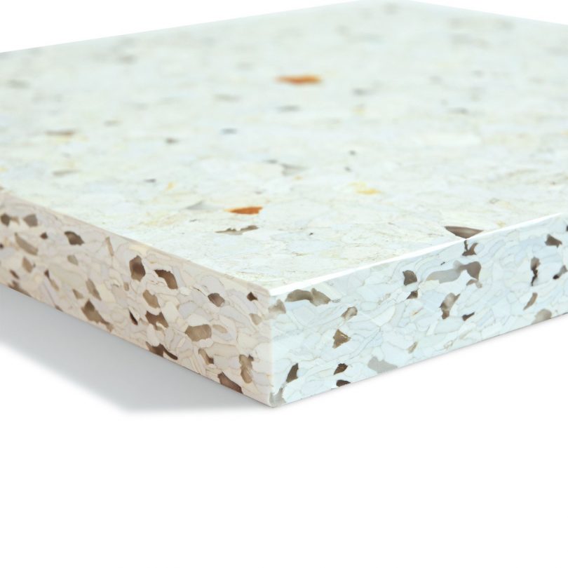 angled end view of white terrazzo like material