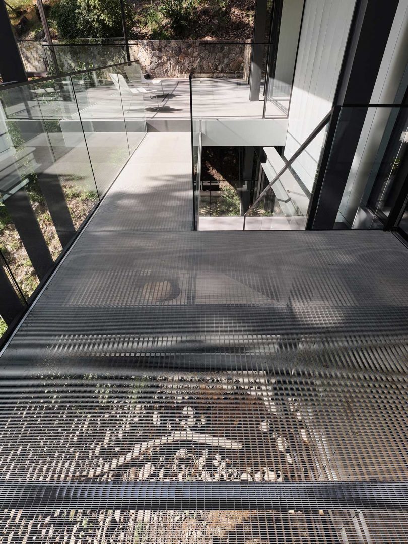 closeup exterior view looking down through metal walkway of modern house