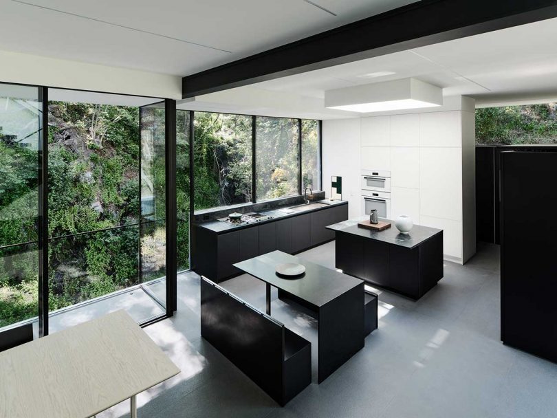 interior view of modern, minimalist house with black and white finishes