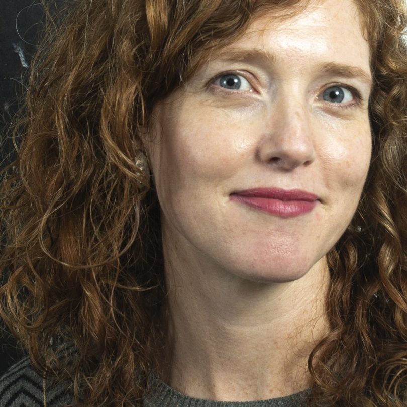 cropped shot of woman's face with curly hair