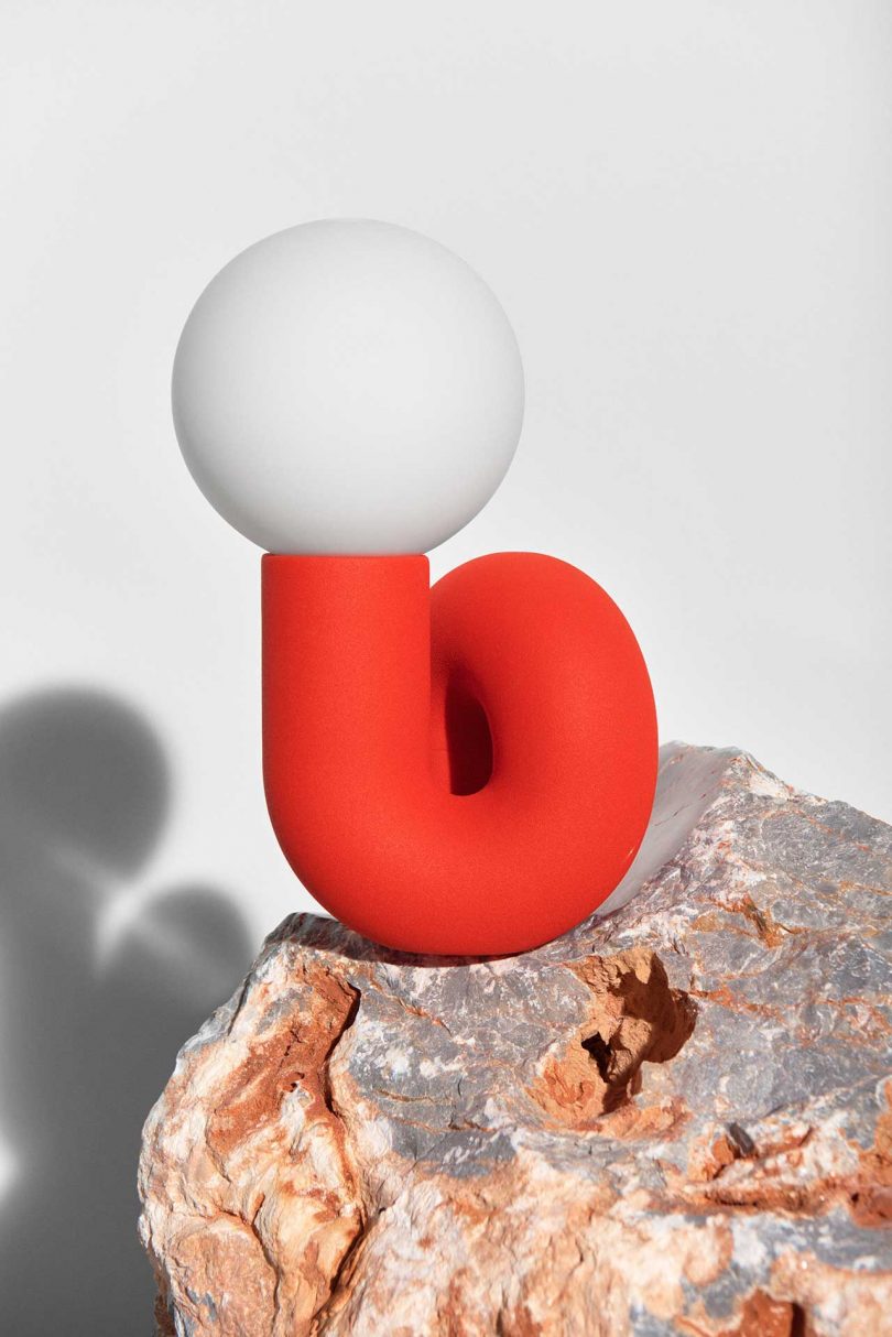 red curvy table lamp