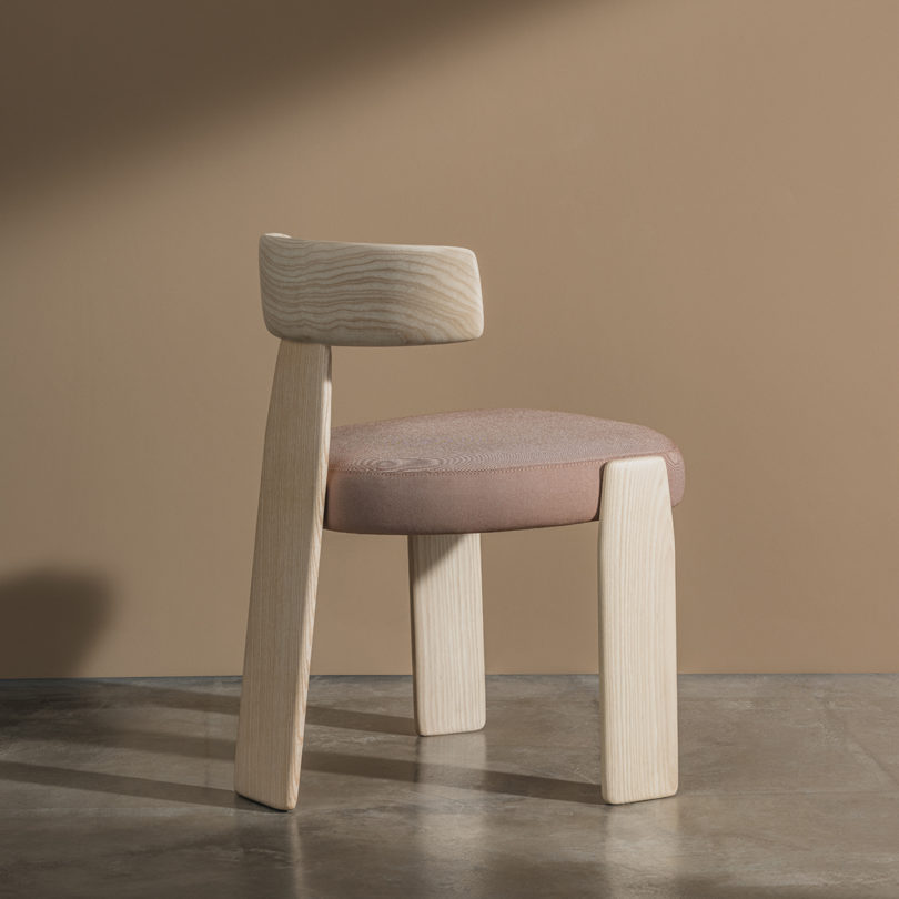 light wood dining chair with light pink upholstery