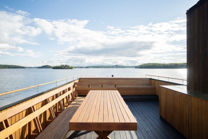 above view of modern wooden floating sauna on water