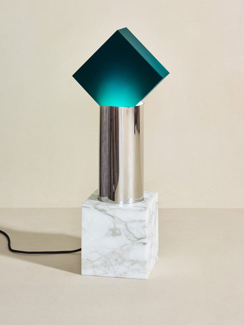 modern lighting with marble base and teal "shade"