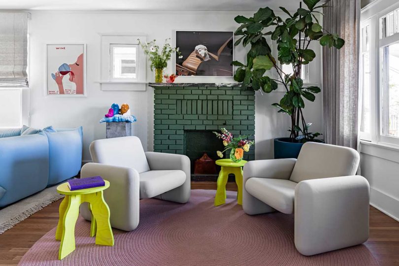 modern living room sitting area with two grey chairs and lime green tables