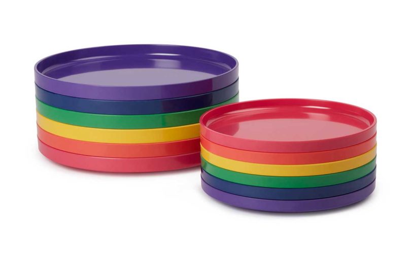 two stacks of rainbow colored dinnerware side by side