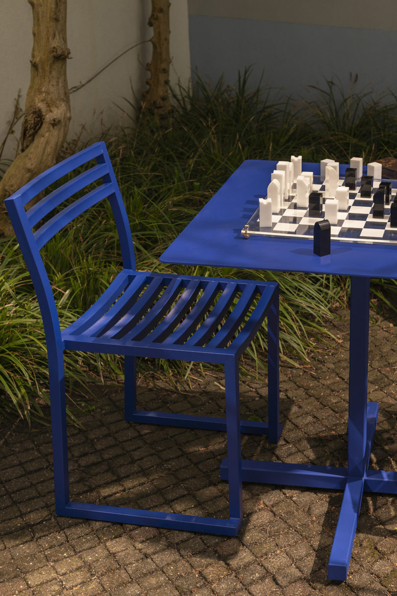 styled electric blue cafe table and chair outdoors