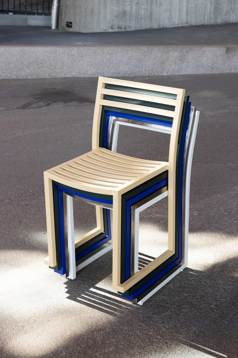 stacked graphite, light grey, electric blue, and beige outdoor chairs