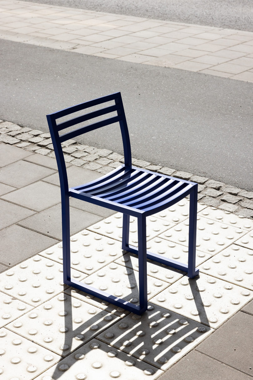electric blue outdoor chair on the curb