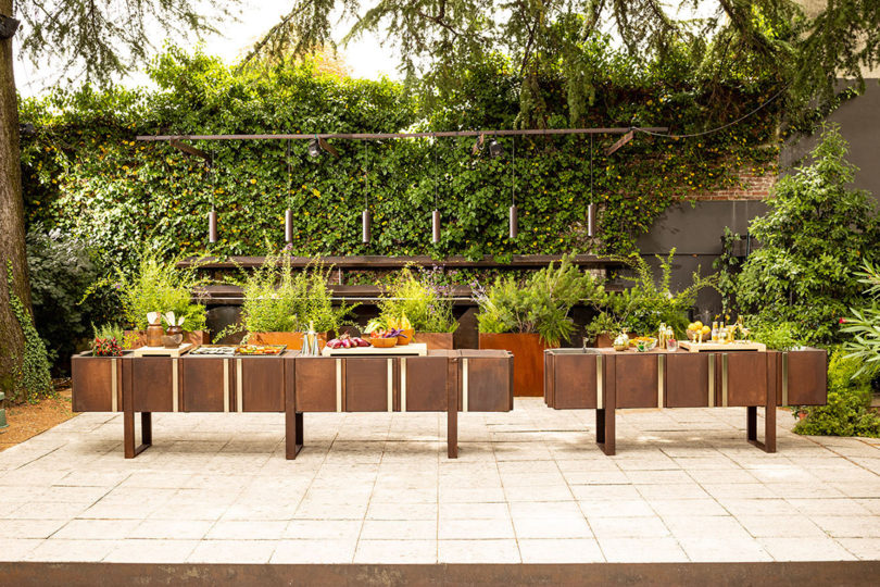 two credenzas on a patio surrounded by greenery
