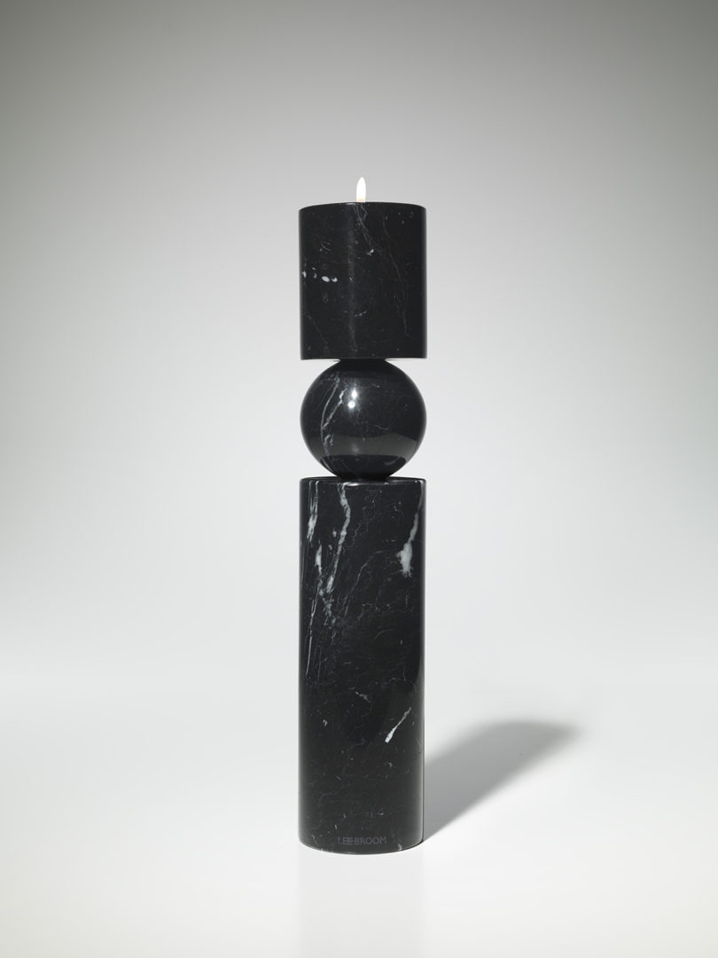 tall black marble candlestick on white background