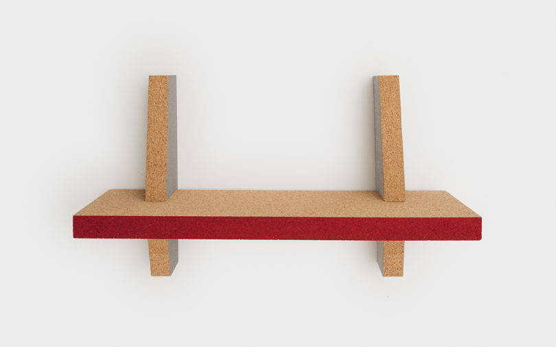 cork wall shelf with red edging
