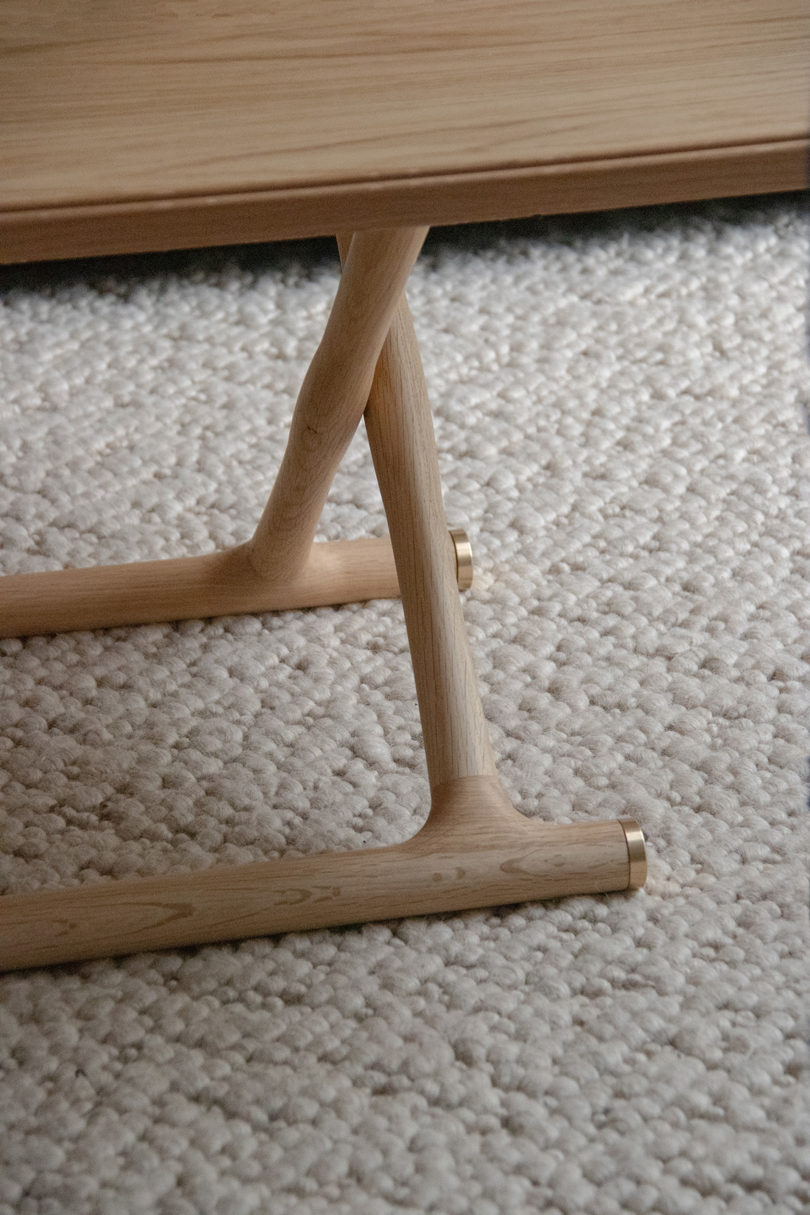 detail of a light oak rectangular folding coffee table