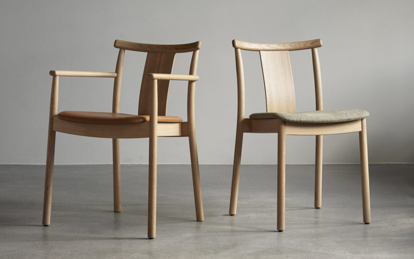 two light oak dining chairs, one with arms and one without