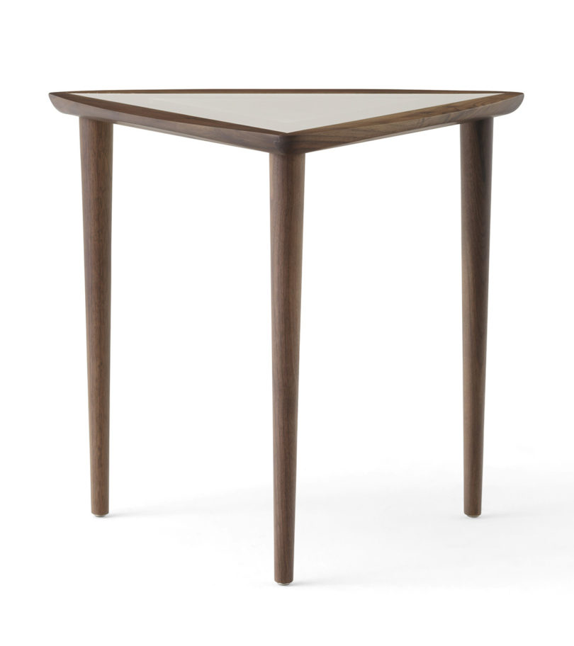triangular wood and laminate nesting table on a white background