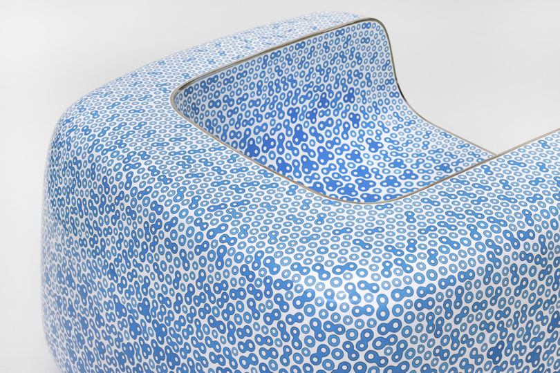 detail of armchair with blue pattern on white on a white background